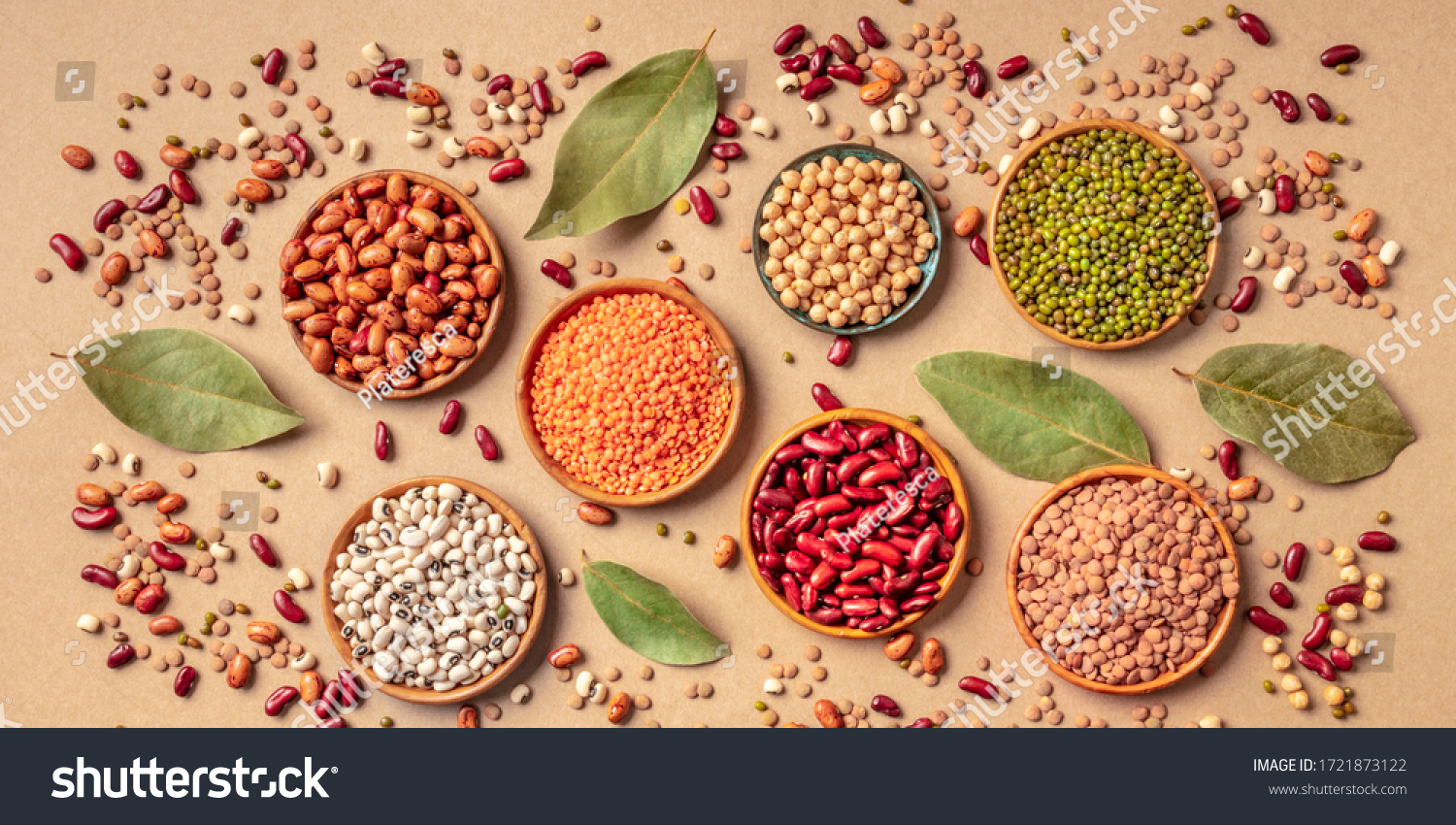 Legumes assortment, overhead panoramic shot on a brown background. Lentils, soybeans, chickpeas, red kidney beans, black-eyed peas, a vatiety of pulses #1721873122