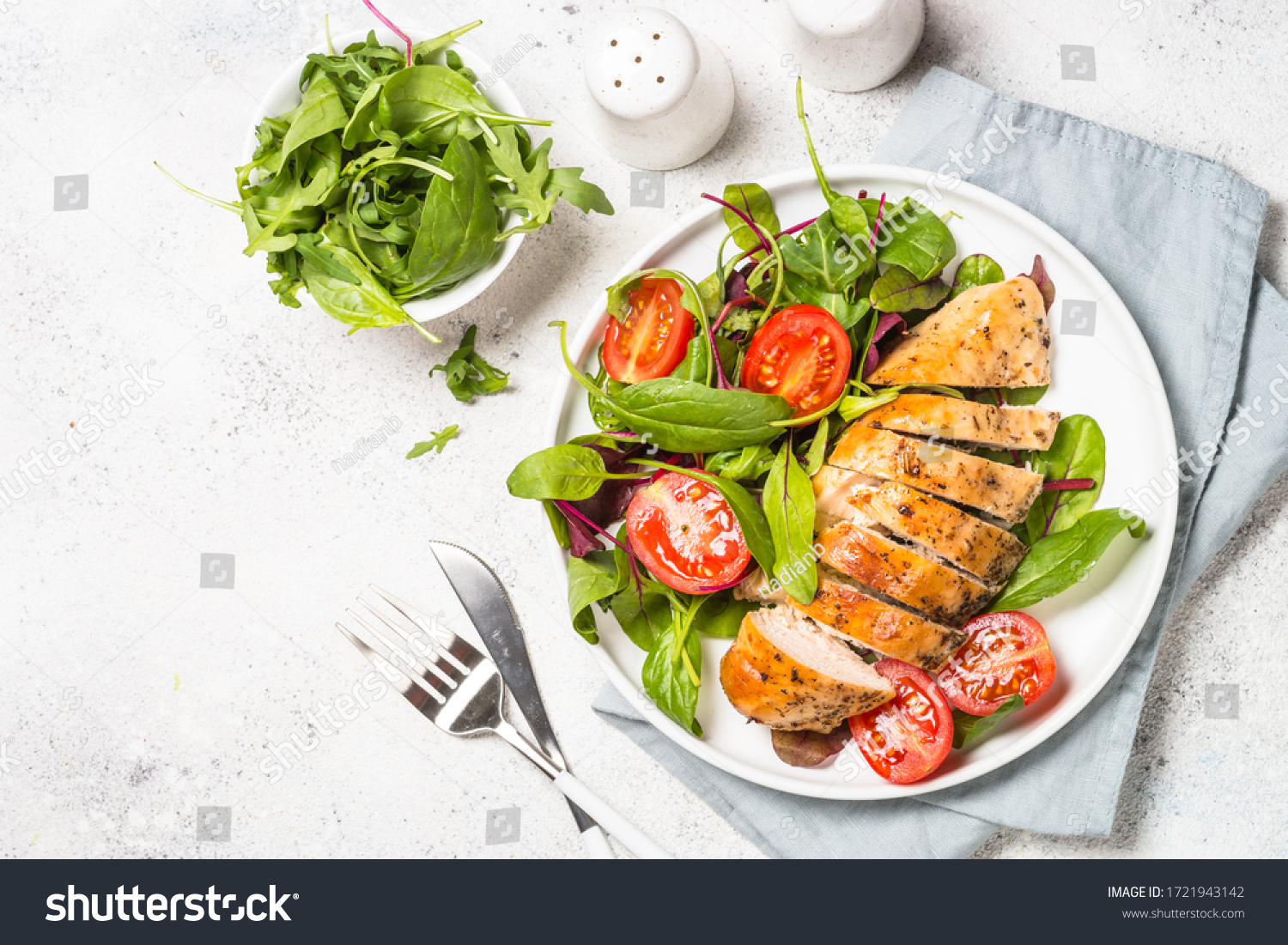 Chicken fillet with salad. Healthy food, keto diet, diet lunch concept. Top view on white background. #1721943142