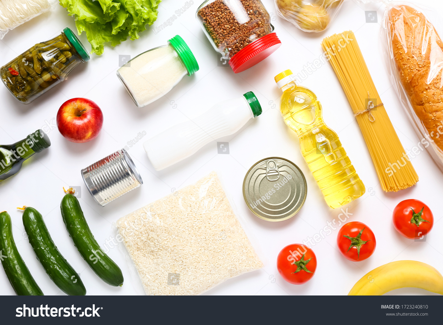 Food supplies for the period of quarantine on white background. Set of grocery items from canned food, vegetables, pasta, cereal. Food delivery concept. Donation concept. Top view. #1723240810