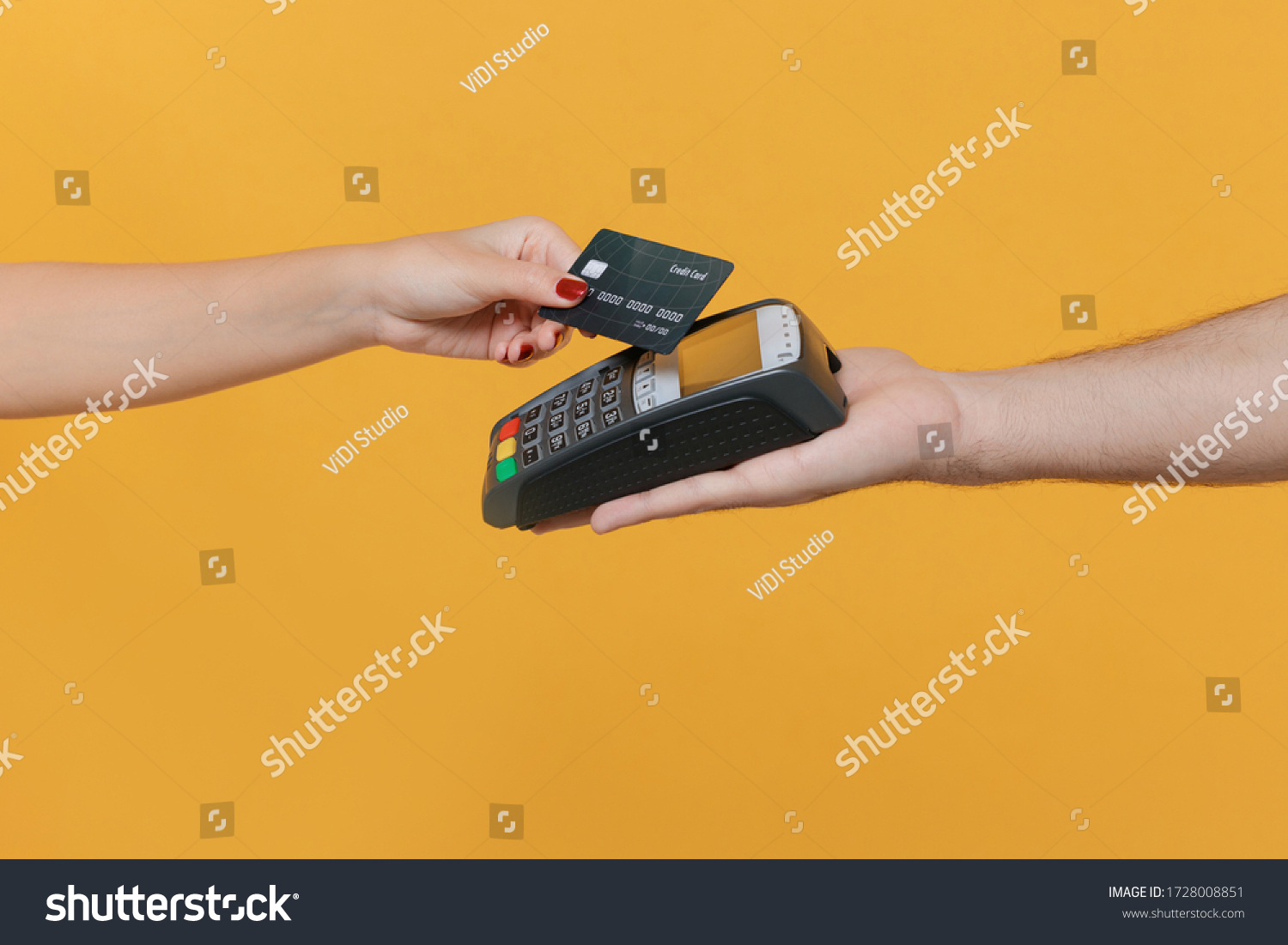Close up cropped photo of female and male hold wireless modern bank payment terminal to process acquire credit card payments isolated on yellow background. Money, achievement, career wealth concept #1728008851