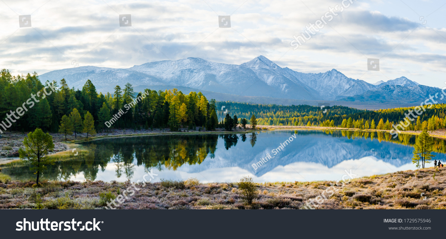 Lake Cicely Altai, Siberia, cloudy autumn day. Taiga, beautiful sky, haze, mountains with snow peaks, panorama. #1729575946