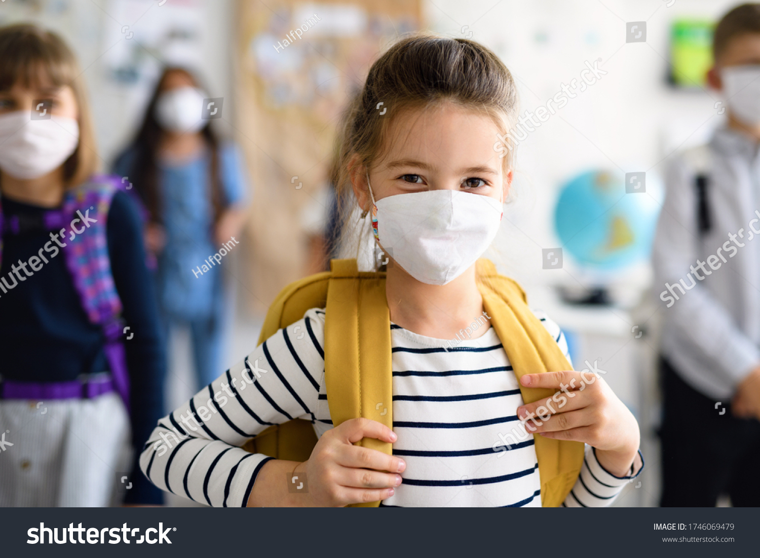 Child with face mask going back to school after covid-19 quarantine and lockdown. #1746069479