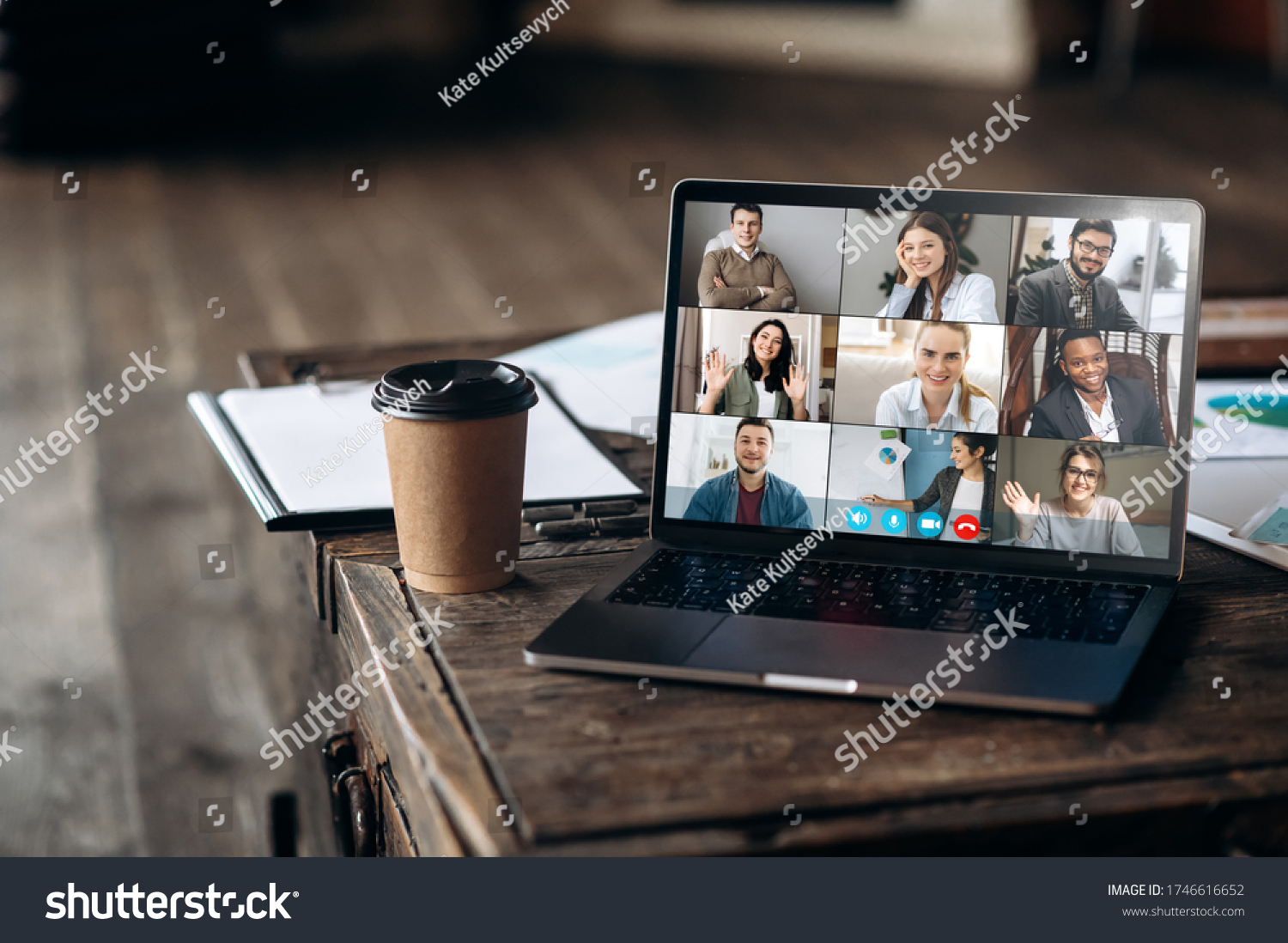 Virtual meeting online. Video conference by laptop. Online business meeting. On the laptop screen, people who gathered in a video conference to work on-line, near stands a cup of coffee #1746616652