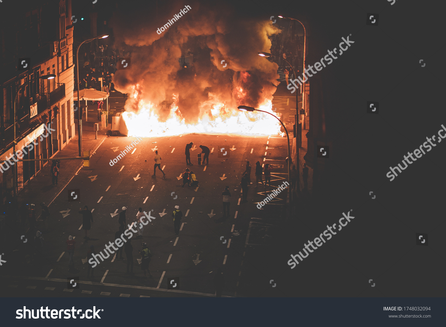 Street in flames with protestants #1748032094