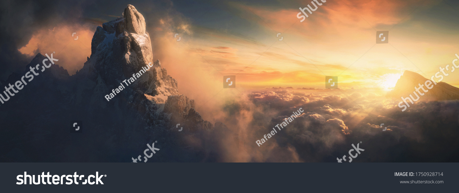 Beautiful aerial landscape of mountain peak at sunset above the clouds - panoramic #1750928714