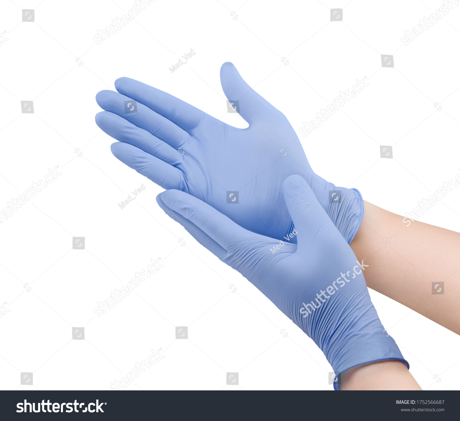Medical nitrile gloves.Two blue surgical gloves isolated on white background with hands. Rubber glove manufacturing, human hand is wearing a latex glove. Doctor or nurse putting on protective gloves #1752566687