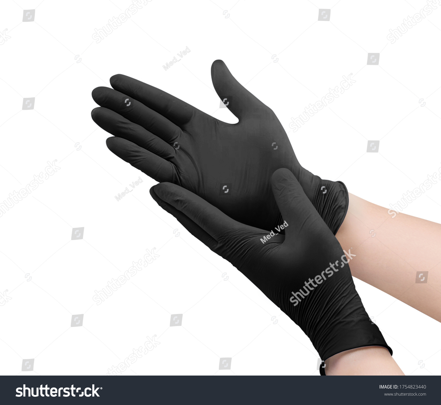 Two black surgical medical gloves isolated on white background with hands. Rubber glove manufacturing, human hand is wearing a latex glove. Doctor or nurse putting on nitrile protective gloves #1754823440