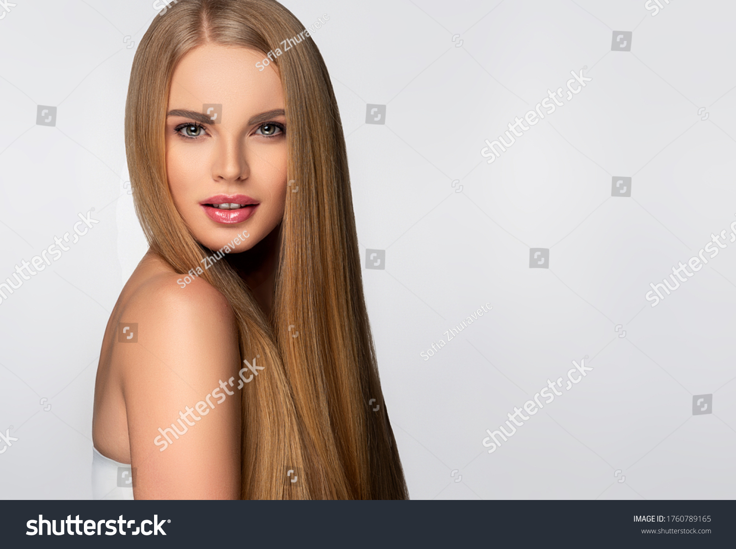 Beautiful model woman with shiny  and straight long hair. Keratin  straightening. Treatment, care and spa procedures. Blonde beauty  girl smooth hairstyle #1760789165