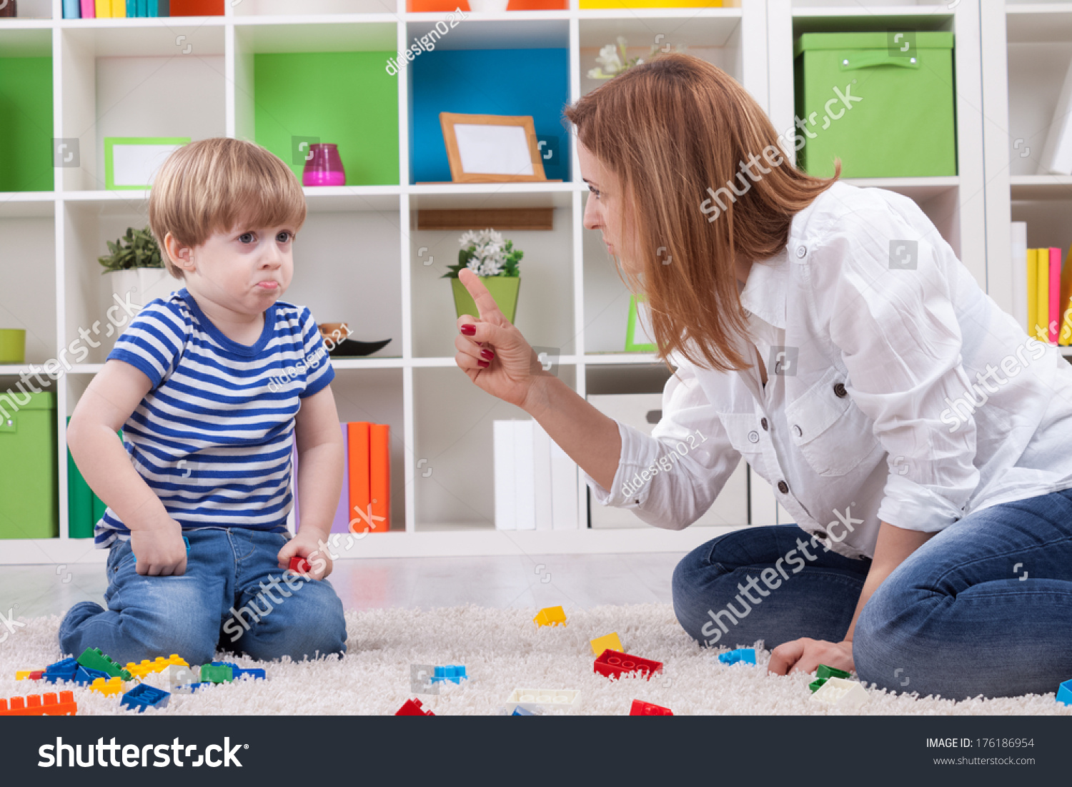 Angry mother scolding a disobedient child #176186954