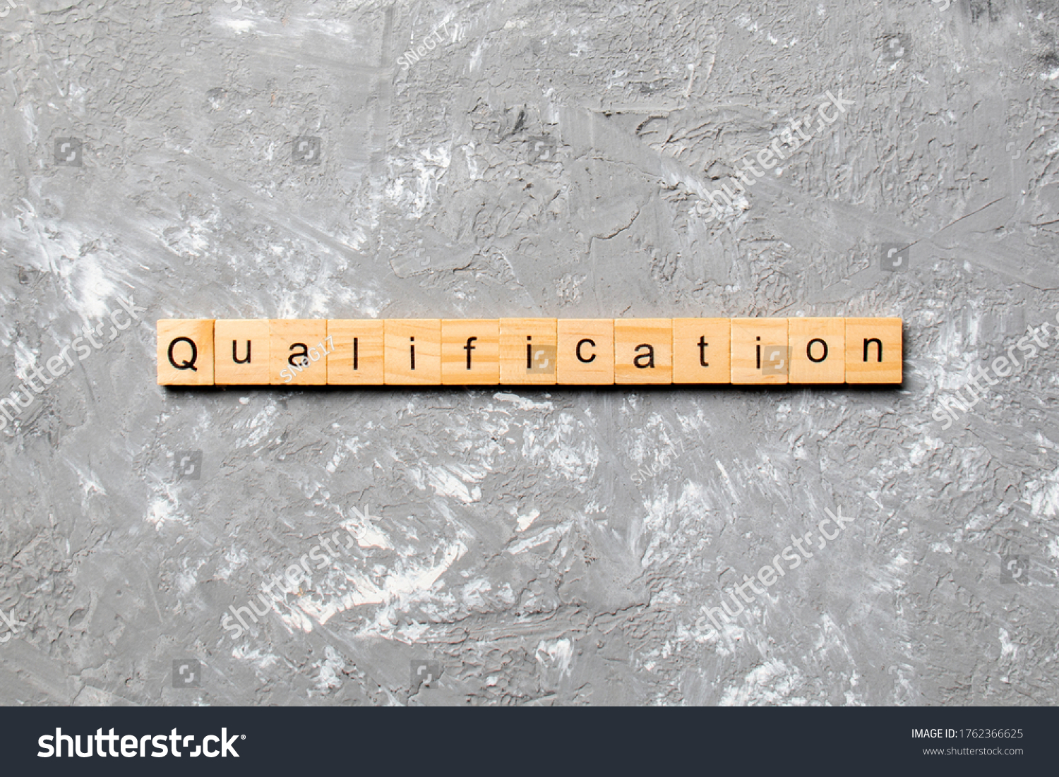 qualification word written on wood block. qualification text on table, concept. #1762366625