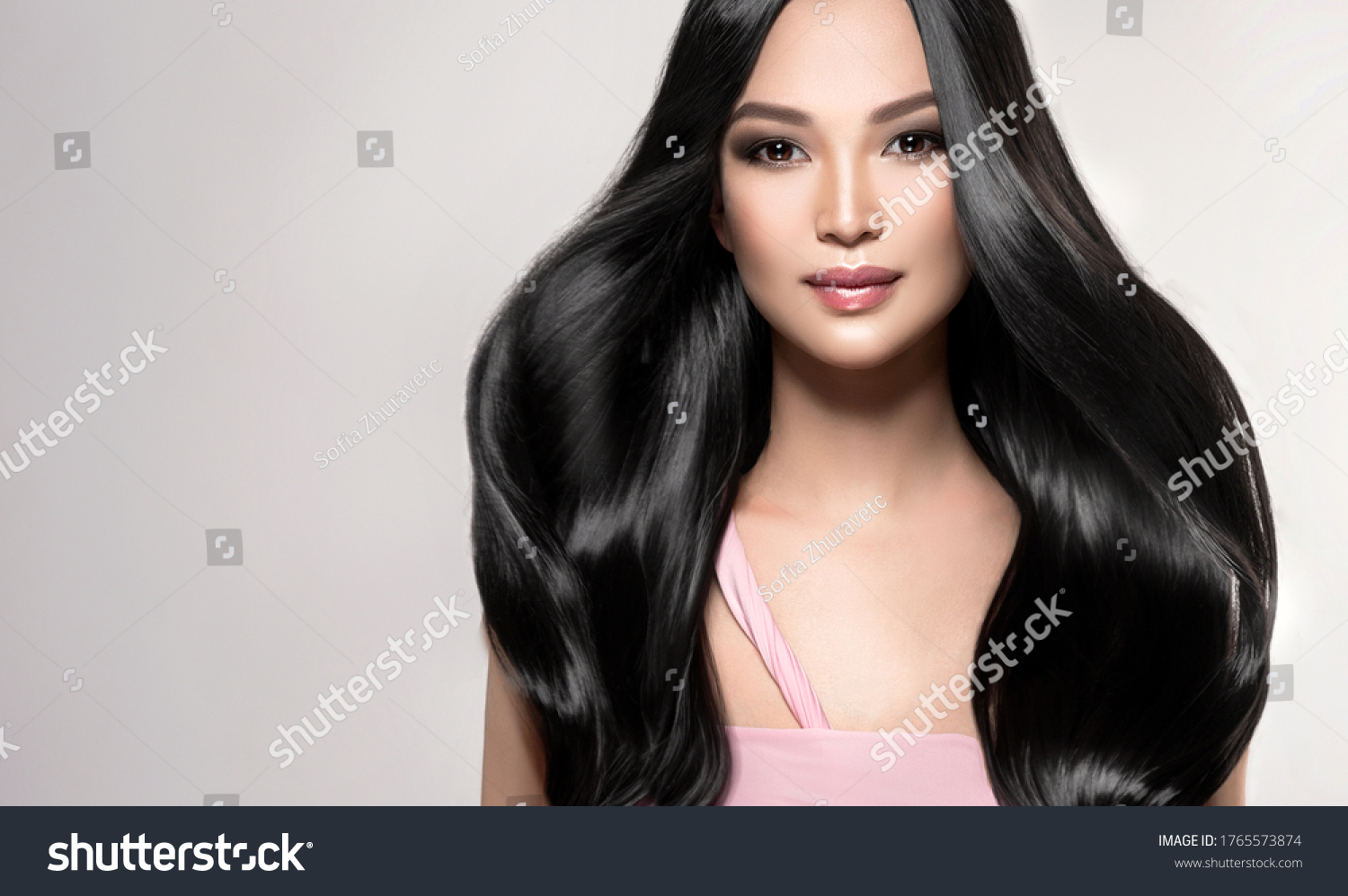Beautiful asian model girl with shiny black and straight long hair . Keratin straightening . Treatment, care and spa procedures for hair . Chinese girl with smooth hairstyle #1765573874