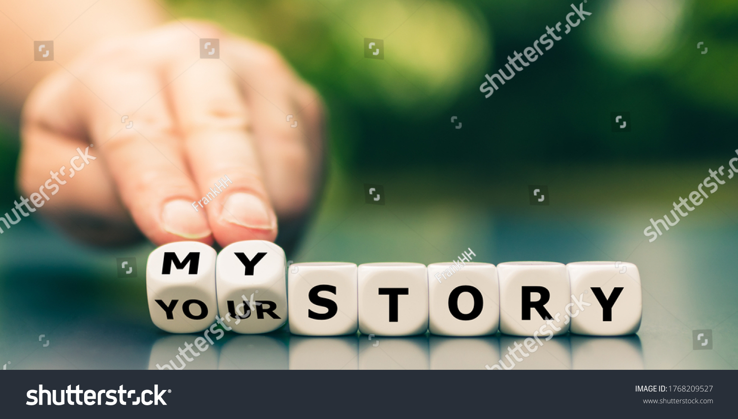 Hand turns dice and changes the expression "your story" to "my story". #1768209527