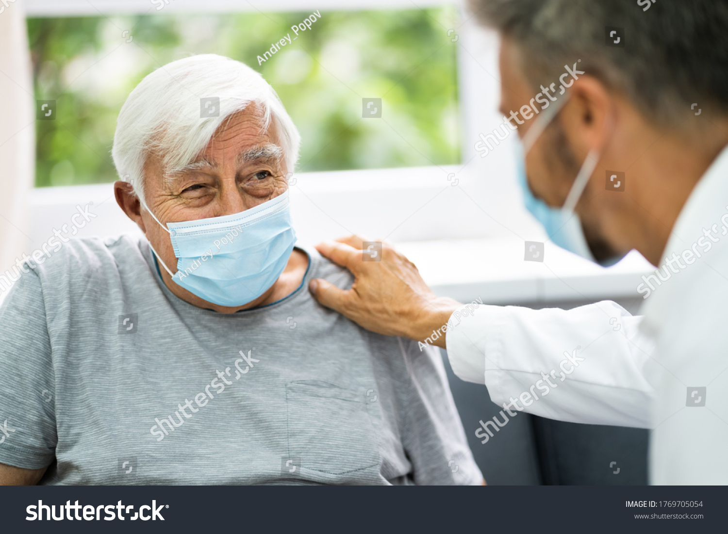 Doctor Talking To Elderly Patient At Home #1769705054