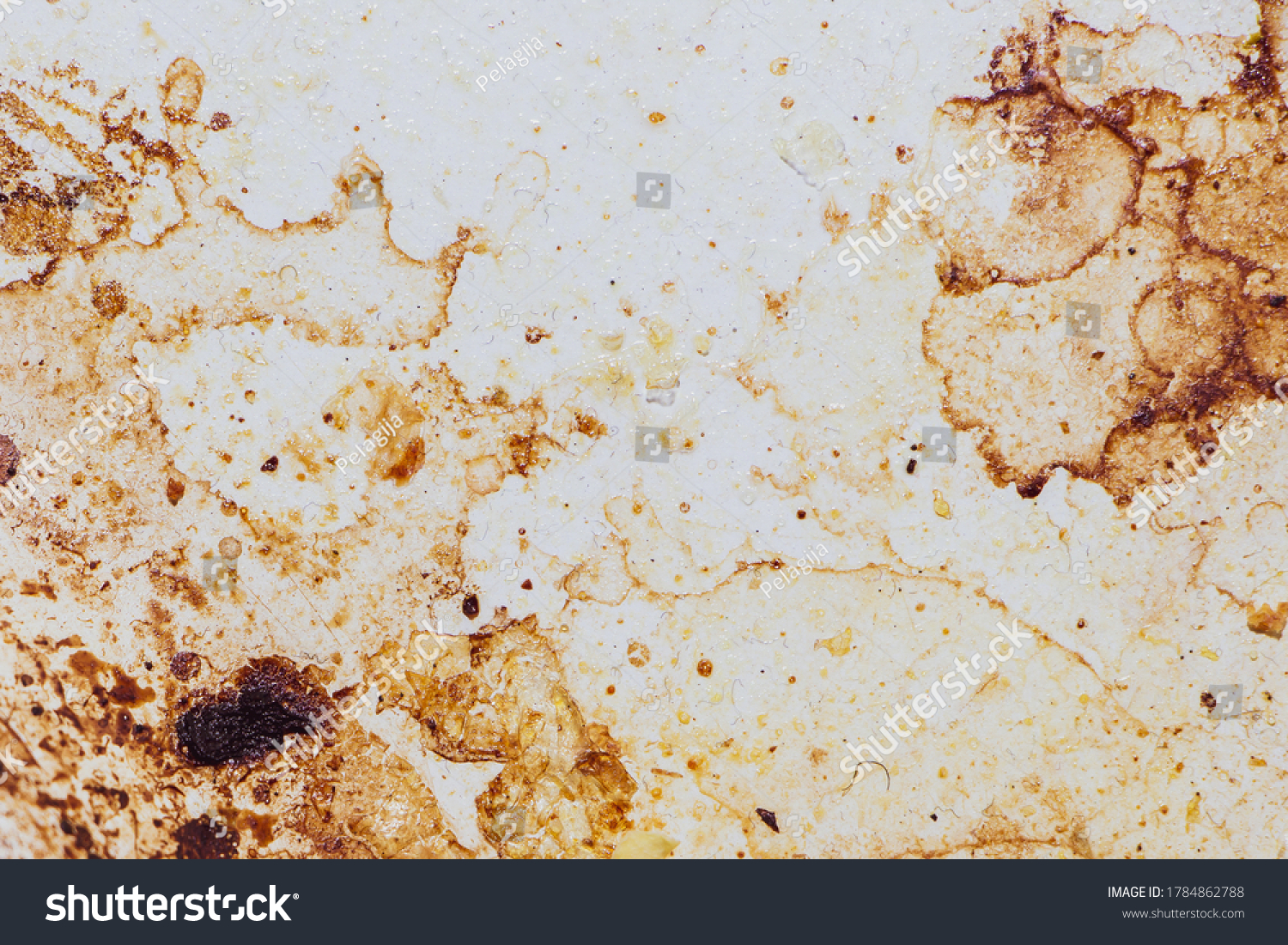 Texture of dirty stains and grease on white stove. Spots of fat on a white background #1784862788