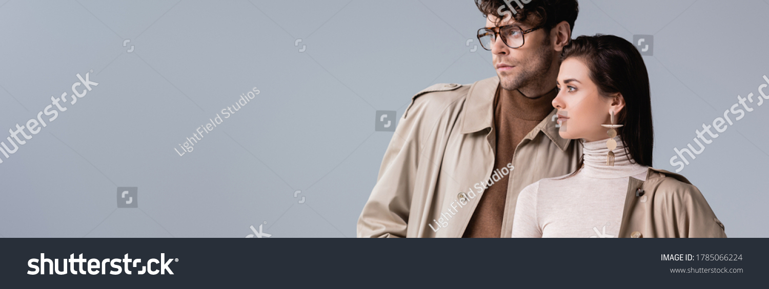 website header of fashionable couple looking away isolated on grey #1785066224