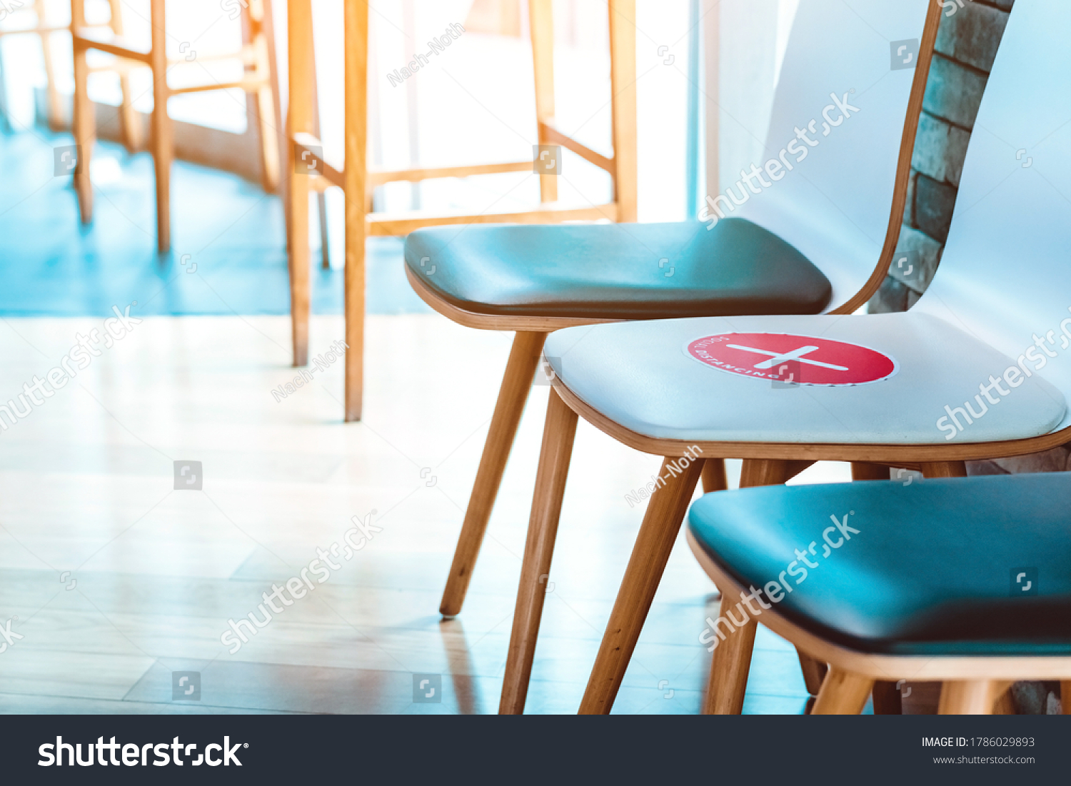 Alternative seating mark for social distance rules in the cafe distance for one seat from other people to protect from Corona Virus(COVID-19), social distancing for infection risk.New normal lifestyle #1786029893