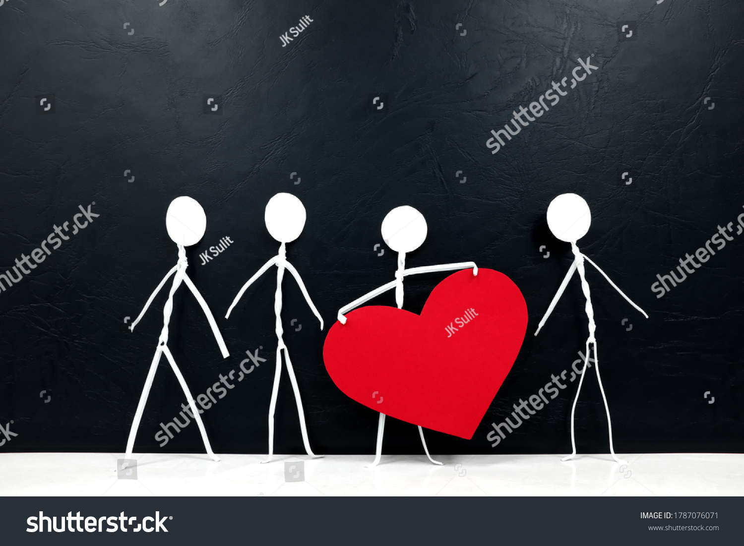 Stick man holding big red heart shape while sharing to other people. Share love and kindness concept. #1787076071