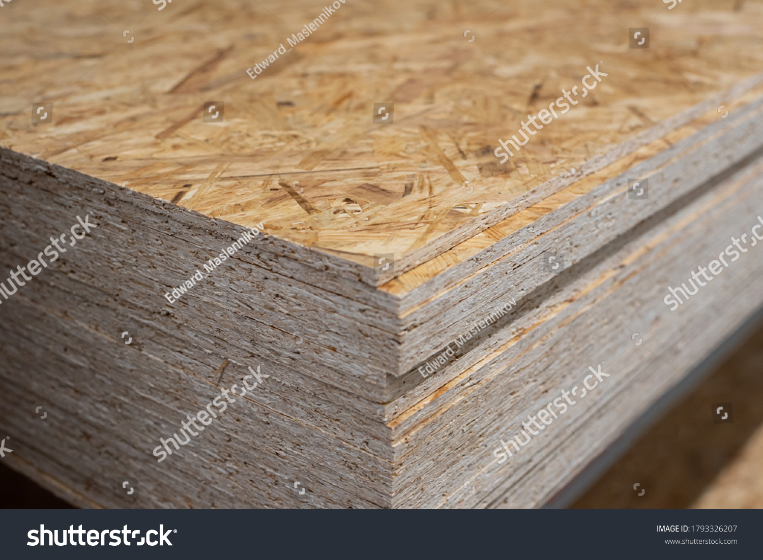 OSB sheets are stacked in a hardware store. Building material wood #1793326207