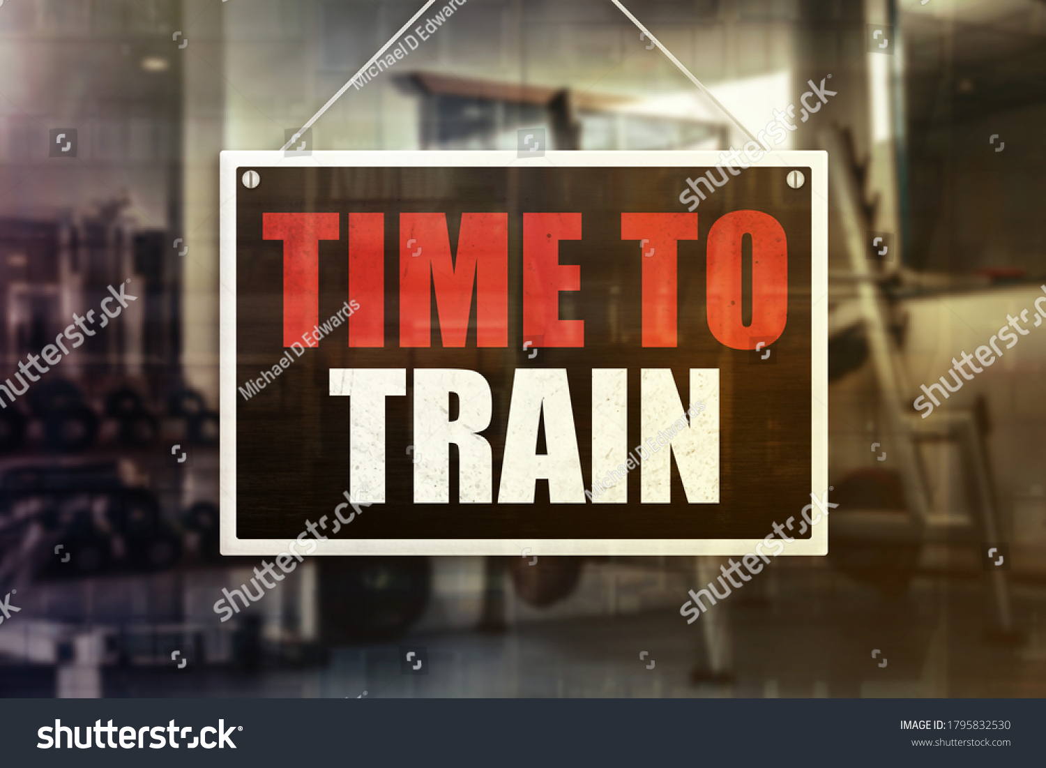 Time to Train Sign in front of a gym background. Motivation or encouragement concept. #1795832530