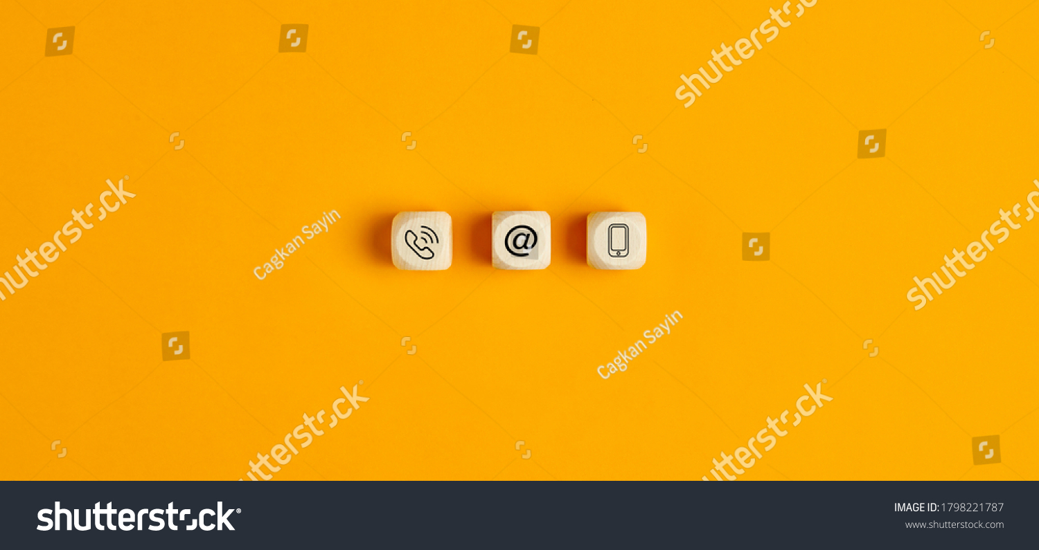 Online business communications concept with icons on wooden cubes on yellow background #1798221787