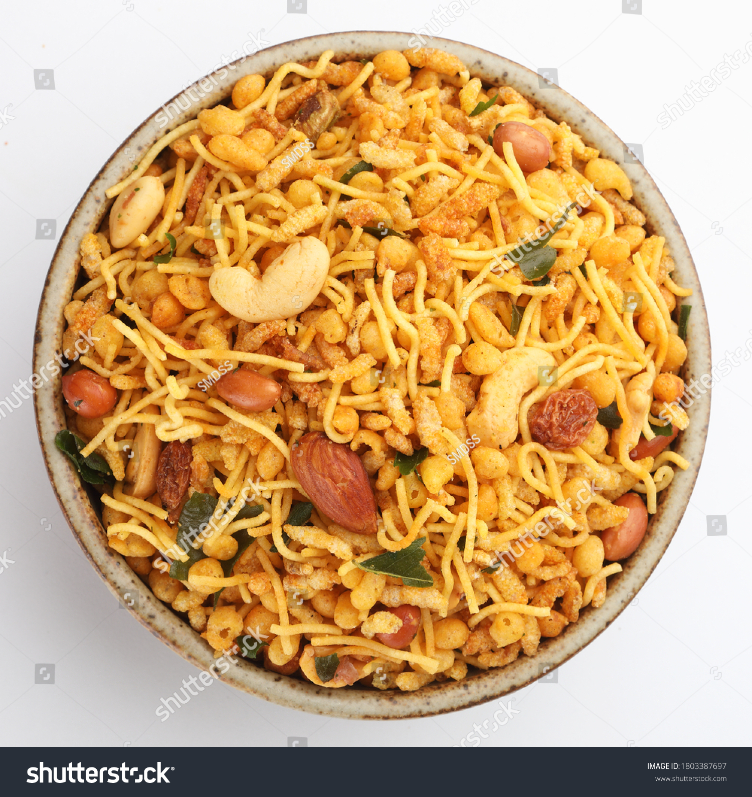 Indian Namkeen Snacks served in ceramic bowl & plate or Indian traditional Namkeen Food Mixture or Navratna Mix Namkeen Also Know as Nimco, Namkin, Mixture ,chiwda or Nimko

 #1803387697