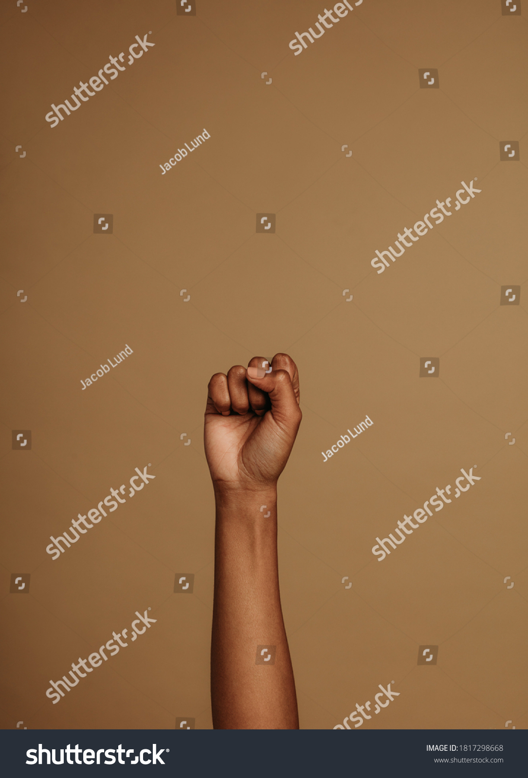 Closed fist sign associated with black lives matter movement. Cropped shot of fist raised up . #1817298668