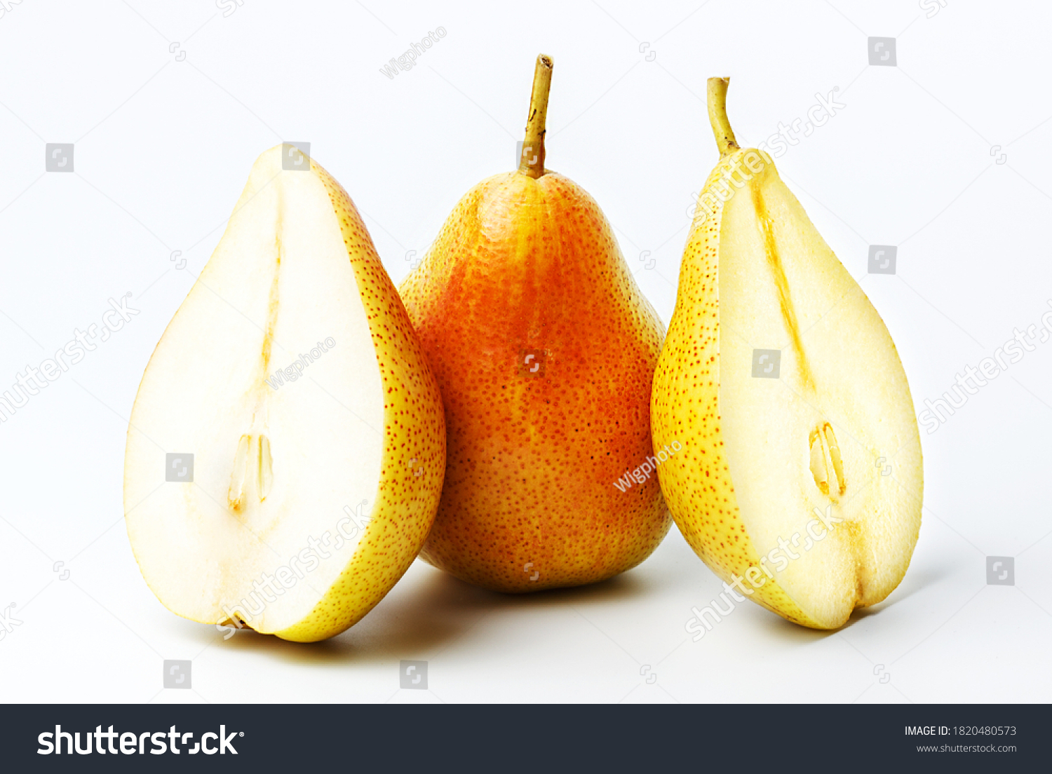 Whole and two half  pears on an isolated background. Big plan. #1820480573
