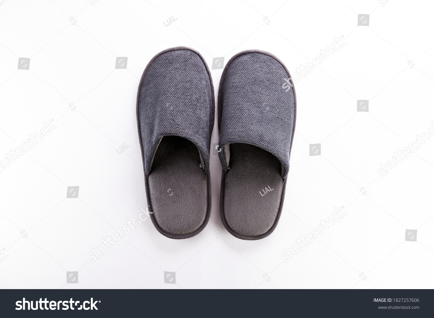 Pair of blank soft gray home slippers, design mockup. Hotel bath slippers top view isolated on white background. Clear warm domestic sandal or sneakers. Bed shoes accessory footwear. #1827257606