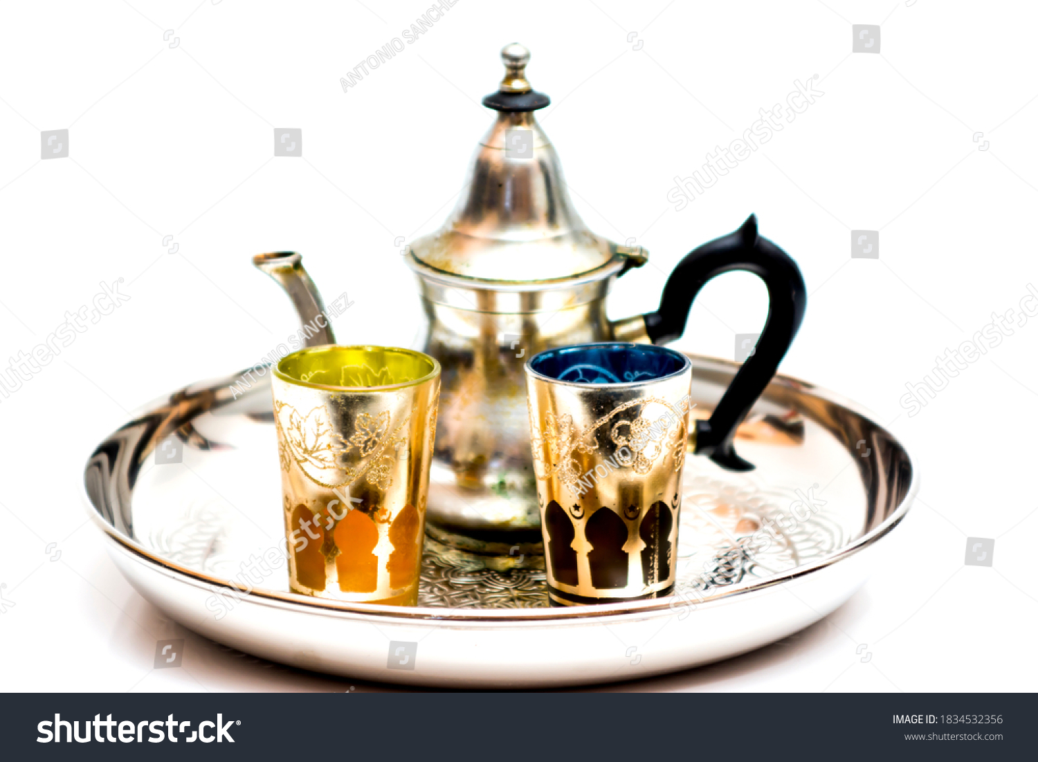Group of teapot and glasses of oriental tea on a tray on white background #1834532356