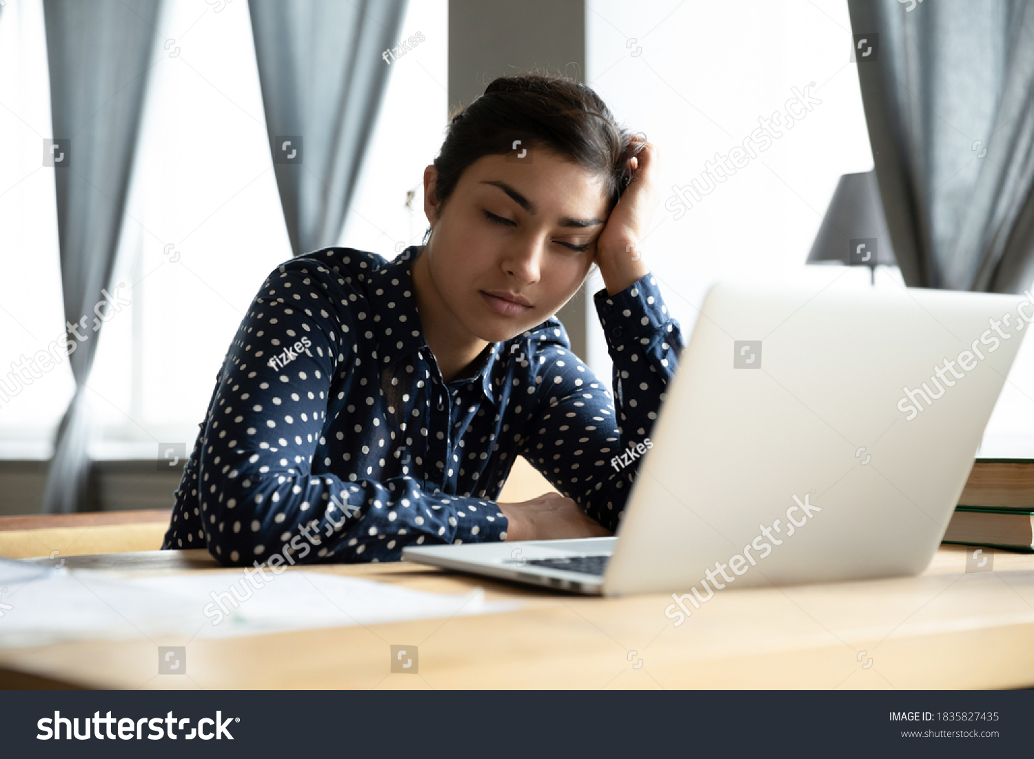 Sleepy indian ethnicity businesswoman fall asleep seated at workplace desk near laptop. Boring job and lack of sleep, unmotivated employee feels disinterested, overworked woman stressful work concept #1835827435