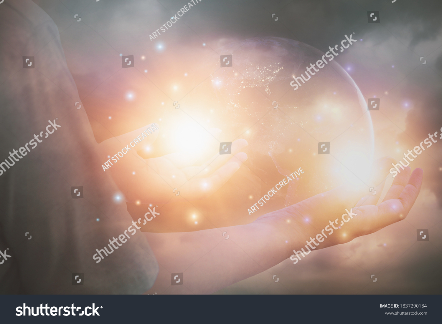 Glittering light shine through hand women,who raise hands,to pray for God blessing,planet and sunset background mind sanctification,concept pure spirit and spirituality,Element image furnished by NASA #1837290184