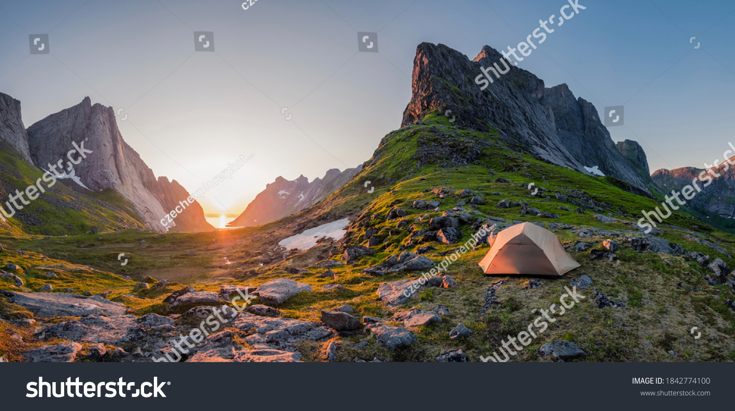 wild camping in the lofoten islands. camping tent among mountains. sunset over camping spot behind polar circle. Panorama of perfect landscape during midnight sun #1842774100