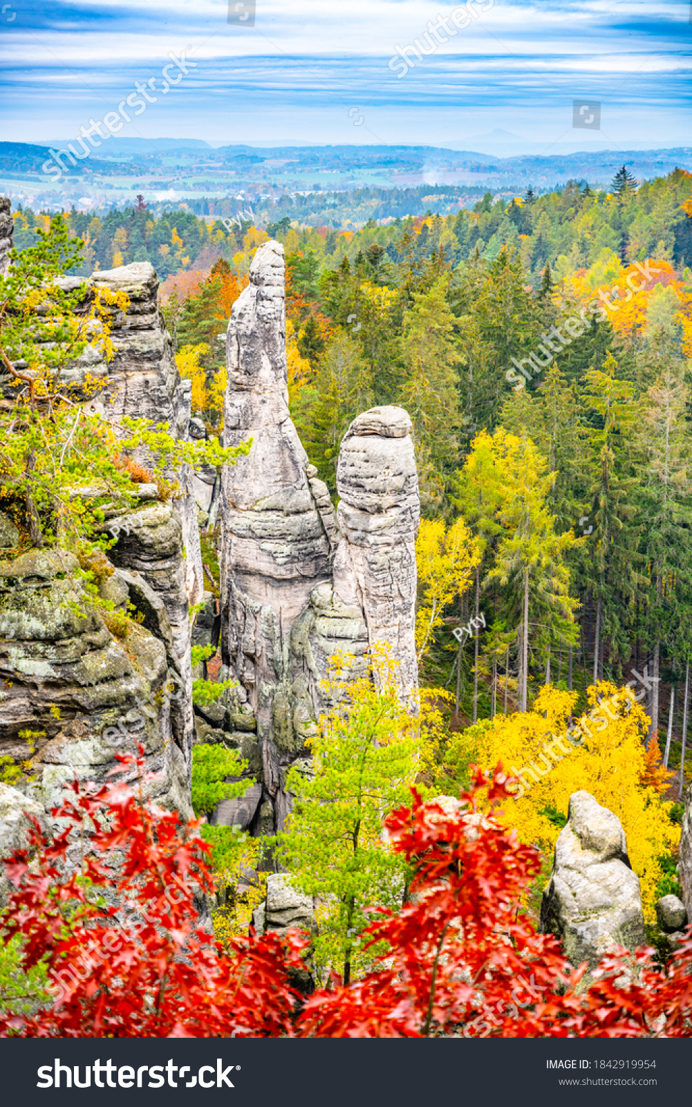 Prachov Rocks, Czech: Prachovske skaly, sandstone rock formation with colorful trees of autumn. View from Bohemian Paradise lookout point, Czech Republic. #1842919954