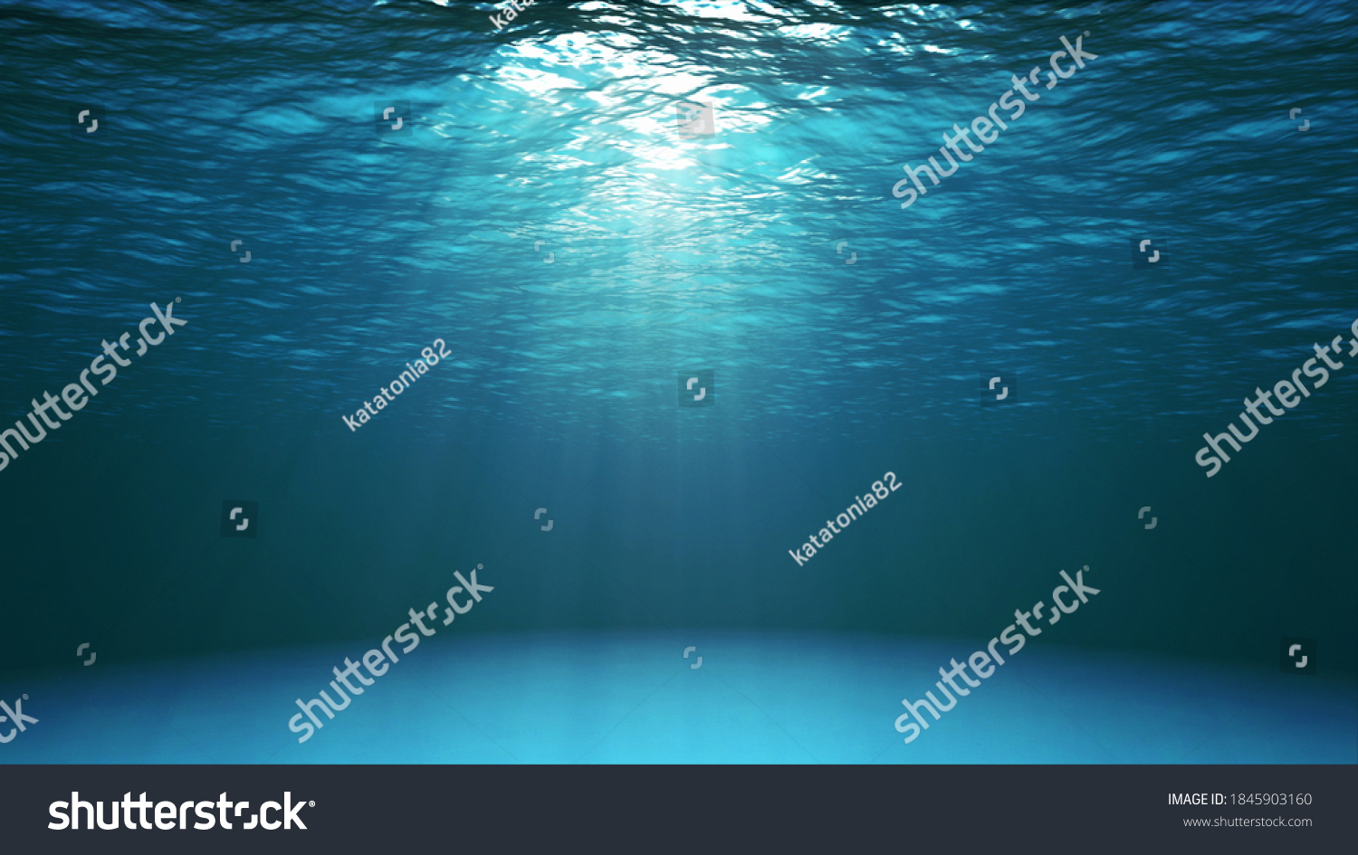 Blue ocean surface seen from underwater. Abstract waves underwater and rays of sunlight shining through water #1845903160