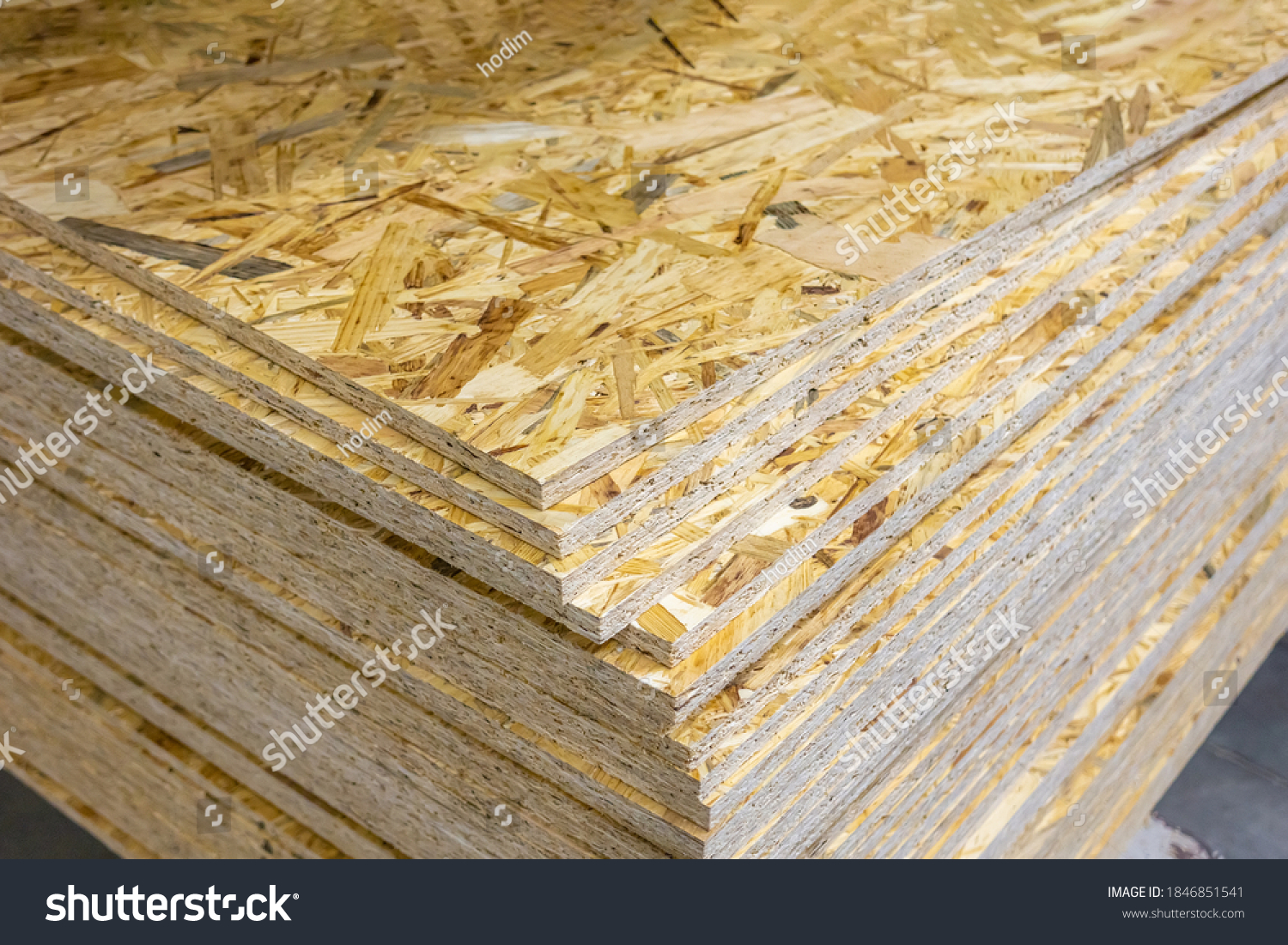 OSB - Oriented strand board. Stacked OSB sheets. Sheet material for the construction of frame houses #1846851541