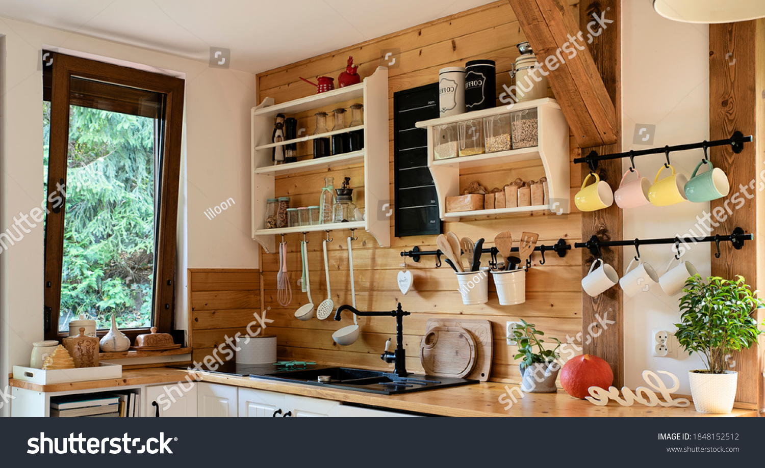 Vintage rustic kitchen in wooden cottage with window and kitchenware. Interior with wooden wall and mug in rural style. Banner #1848152512