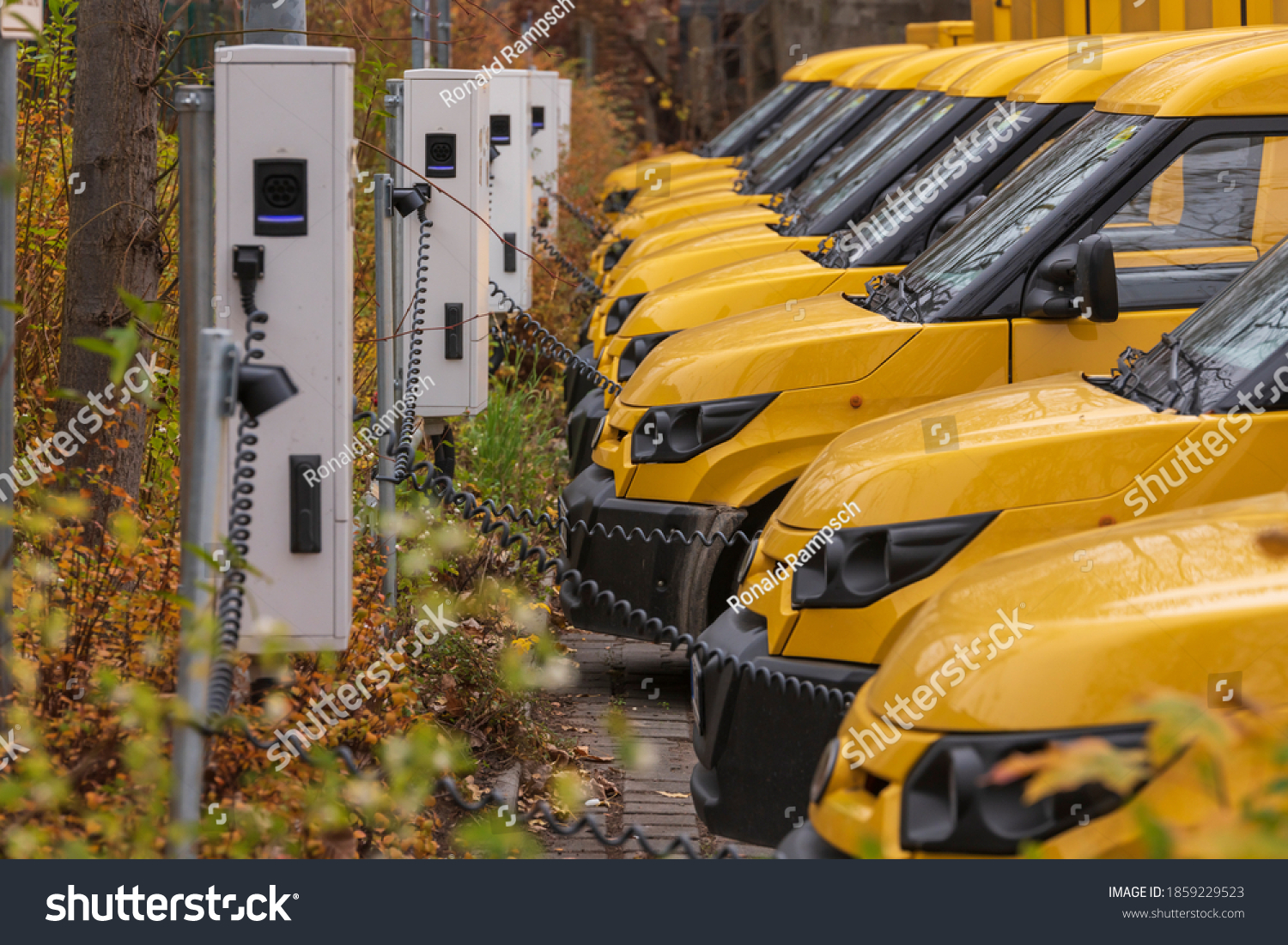 Yellow electric vehicles at the charging station #1859229523