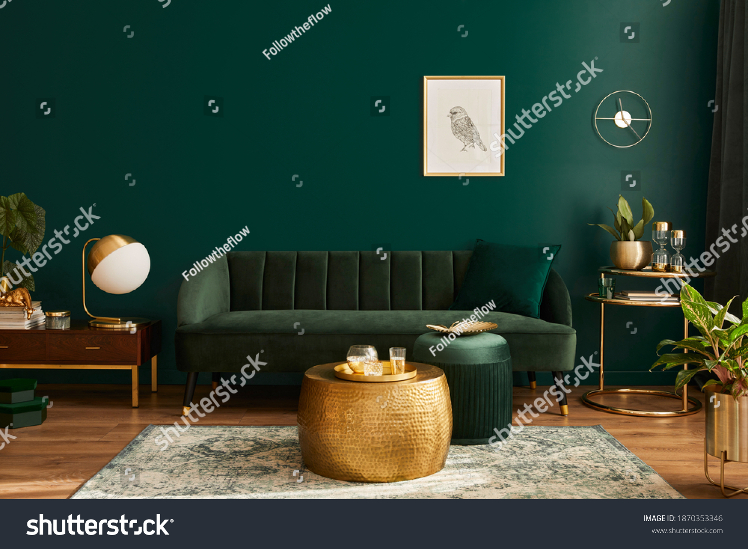 Luxury living room in house with modern interior design, green velvet sofa, coffee table, pouf, gold decoration, plant, lamp, carpet, mock up poster frame and elegant accessories. Template.  #1870353346