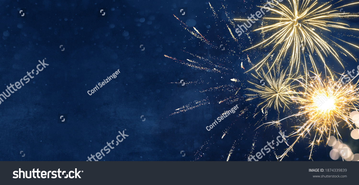 Silvester party New year background banner panorama long- sparklers and bokeh lights on dark blue night sky texture, with space for text #1874339839