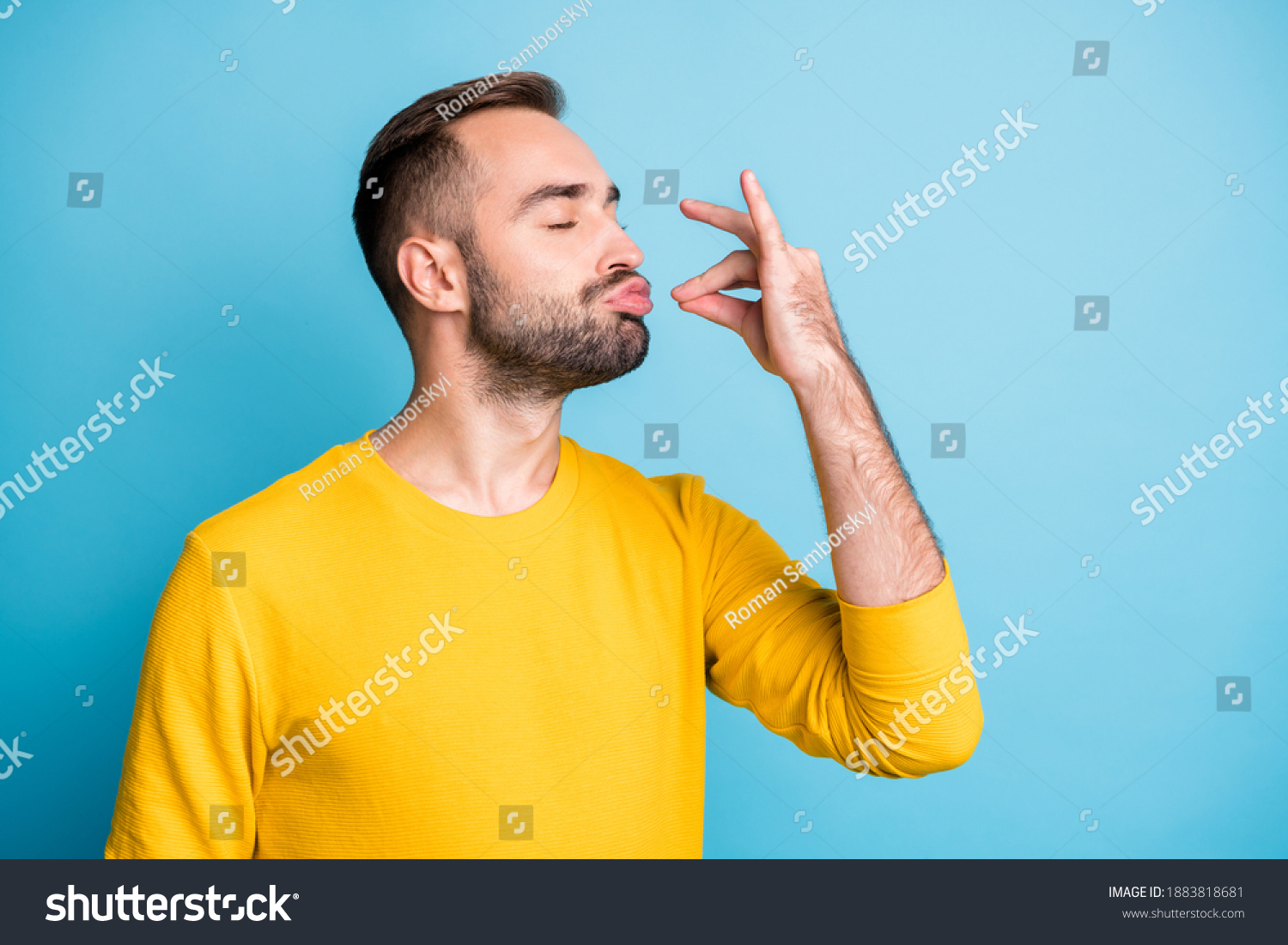 Photo portrait of guy with pouted lips showing gourmet sign with fingers tasty delicious isolated on vibrant blue color background #1883818681