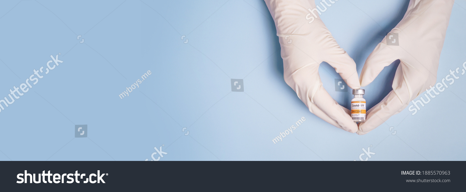Doctor Hands in protective gloves holding Coronavirus 2019-nCoV Vaccine vial and gesture in heart shape. Successful, Hope, Good news, Support, Donation, Priority, Fight with Covid-19 pandemic. Banner. #1885570963