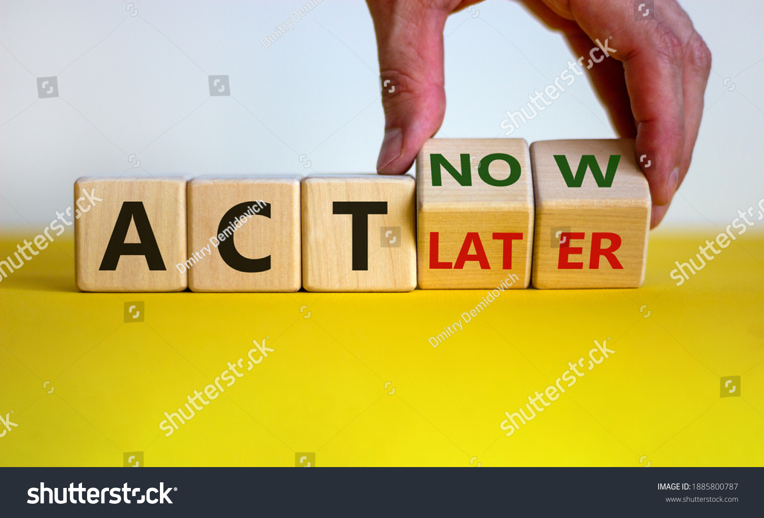 Act now, not later symbol. Male hand turns wooden cubes and changes words 'act later' to 'act now'. Business and act now or later concept. Beautiful yellow table, white background, copy space. #1885800787