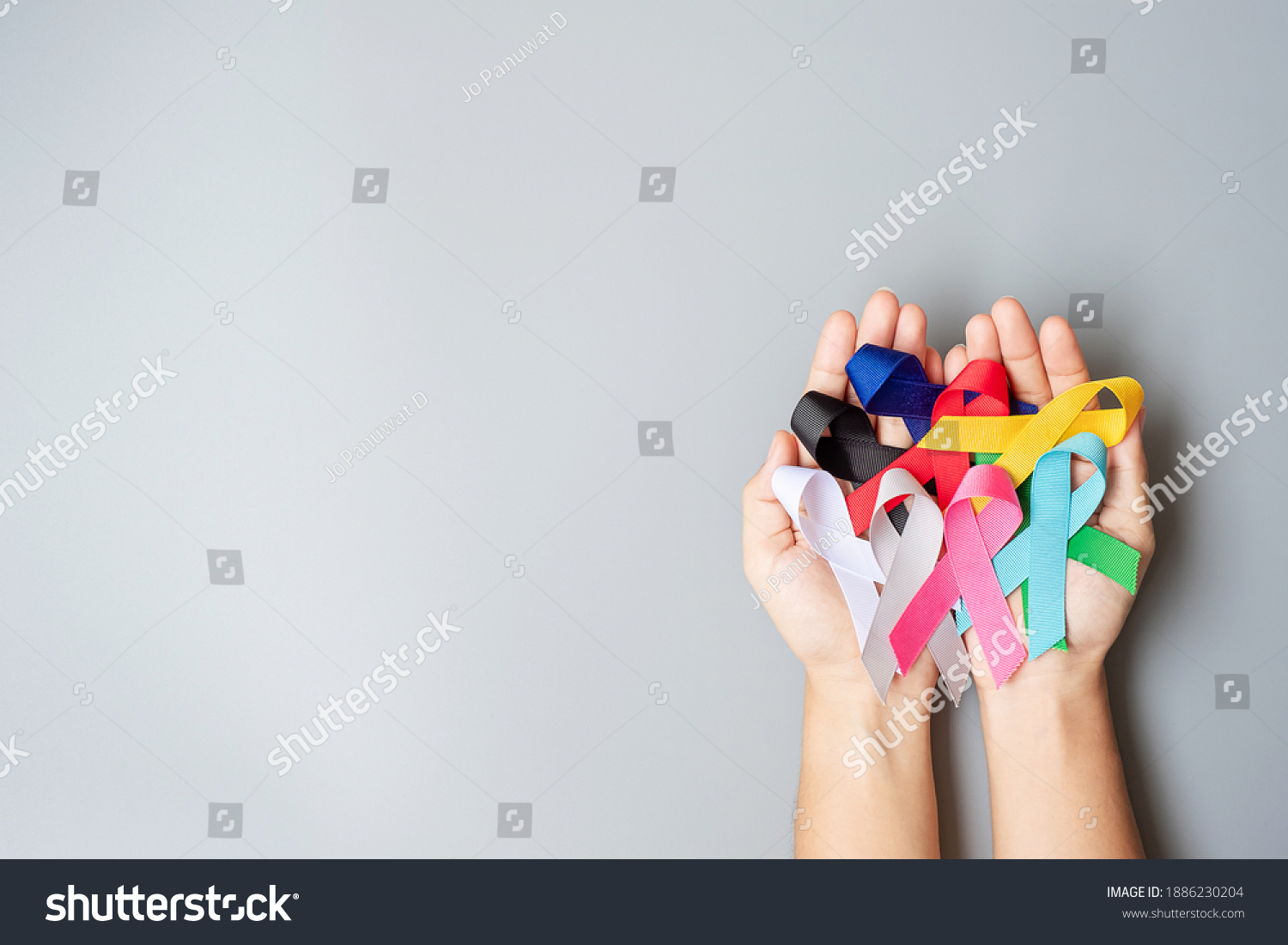 World cancer day (February 4). colorful awareness ribbons; blue, red, green, black, grey, white, pink and yellow color for supporting people living and illness. Healthcare and medical concept #1886230204