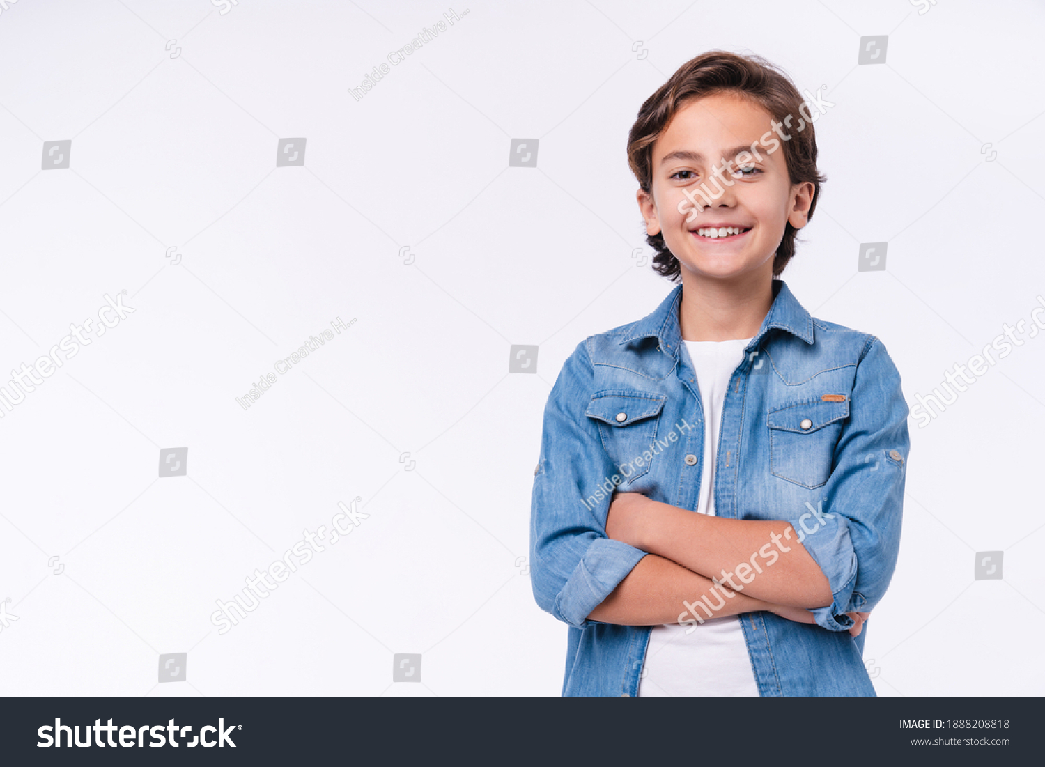 Happy young caucasian boy in casual outfit with arms crossed isolated over white background #1888208818