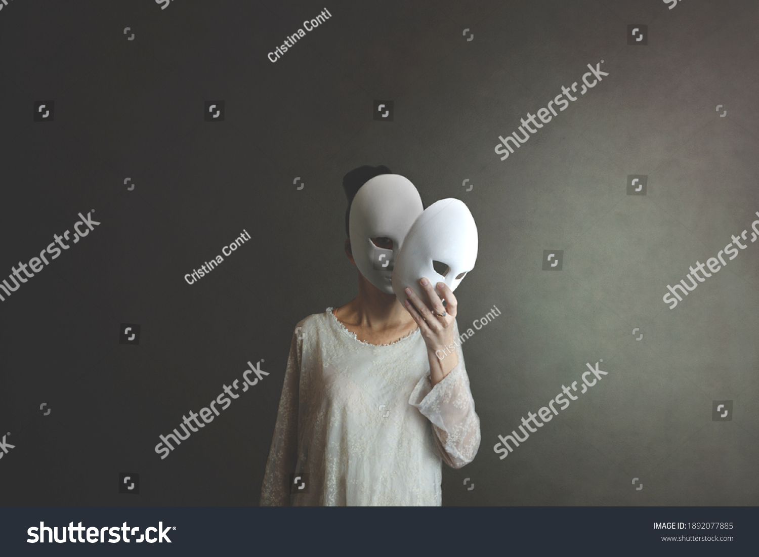 woman takes off the mask from her face but underneath her she has another mask, concept of hiding one's soul and oneself #1892077885