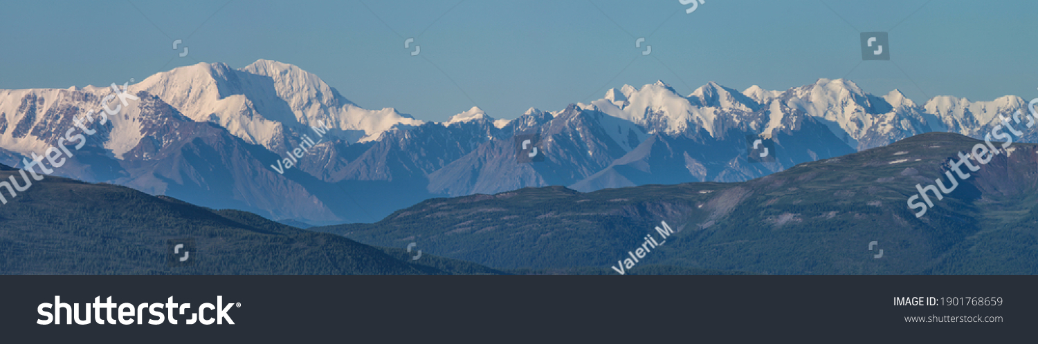 Large panorama. View of the snow-capped mountain range. #1901768659