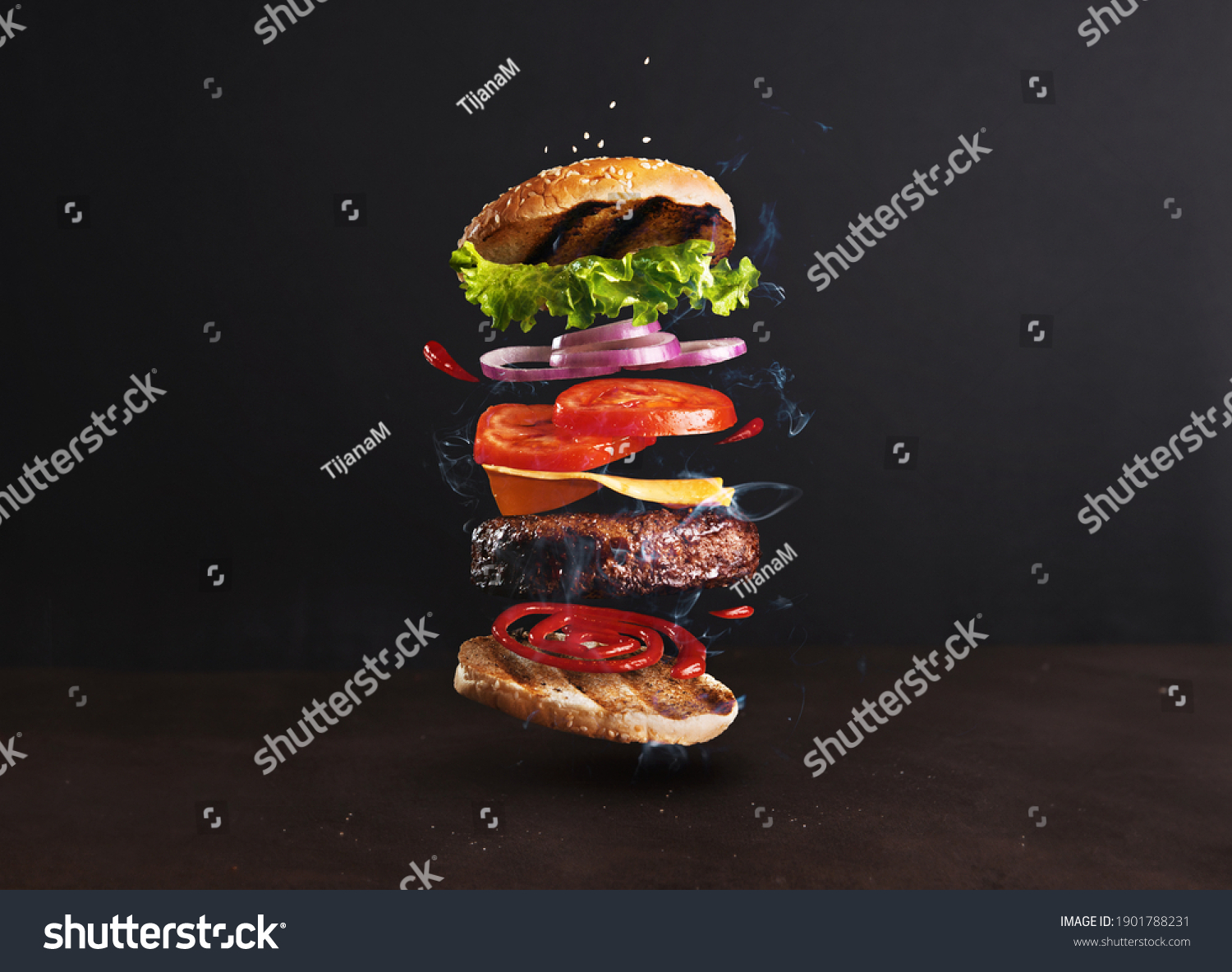 Delicious, juicy burger layers over a dark background #1901788231