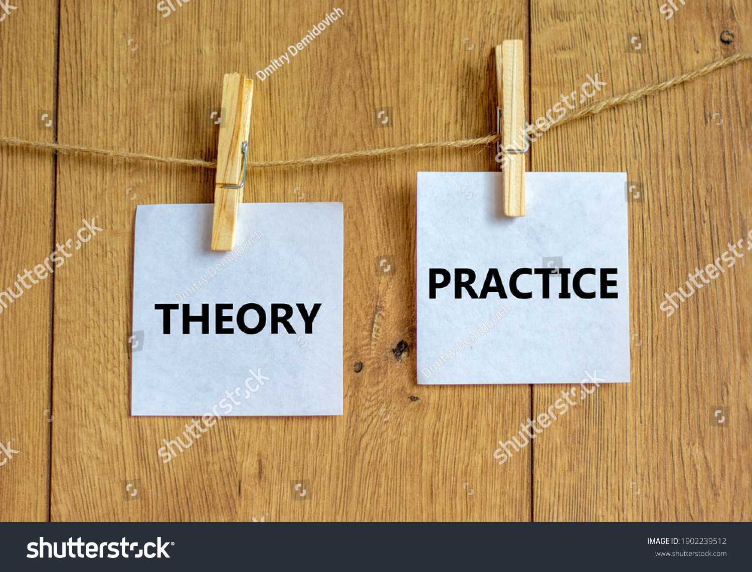 Theory and practice symbol. Wooden clothespins with white sheets of paper. Words 'theory practice'. Beautiful wooden background. Business, theory and practice concept, copy space. #1902239512