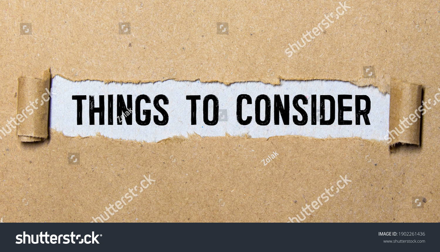 Word writing text Things To Consider. Business concept for think about something carefully in order to make decision Cardboard which is torn in the middle placed above a wooden classic table. #1902261436
