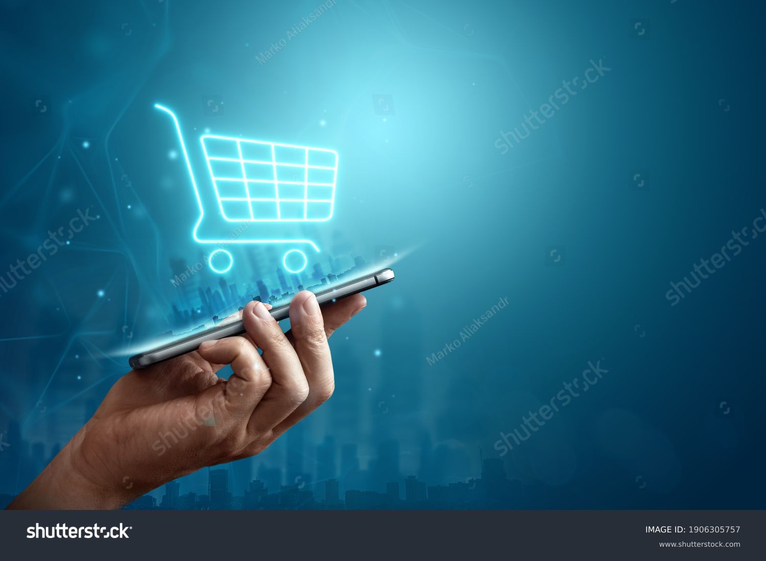 Phone and basket hologram. Online shopping, online store application in a smartphone. Digital Marketing Online #1906305757